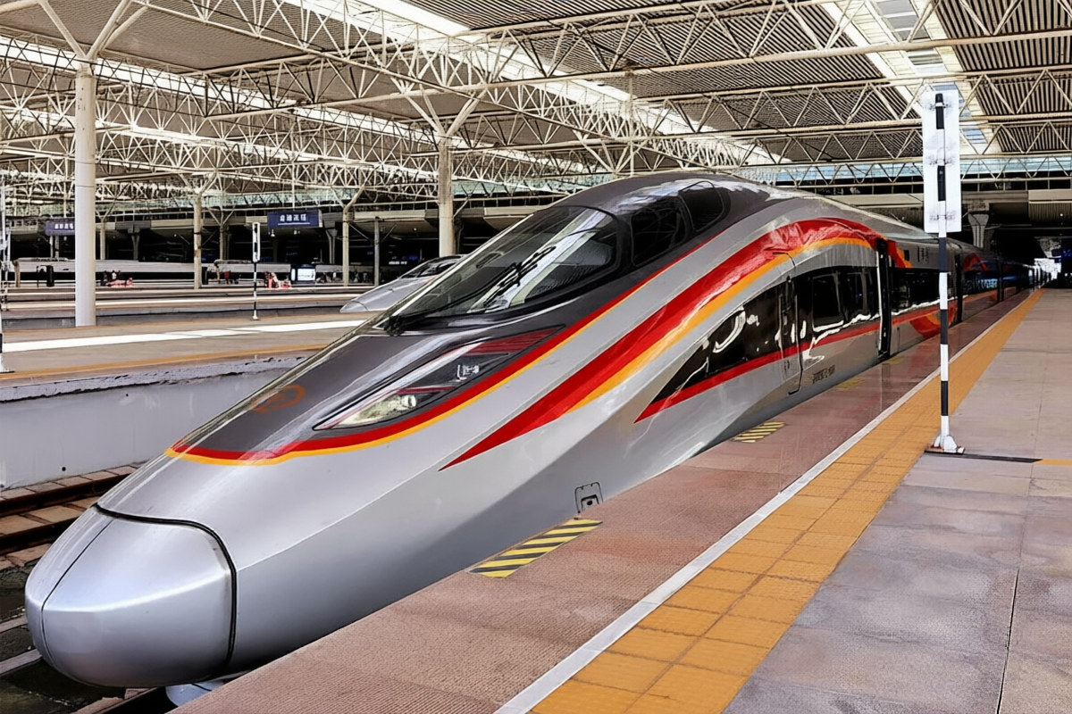 A sleek Fuxing high-speed train at Beijing South Railway Station, ready to depart at 350 km/h